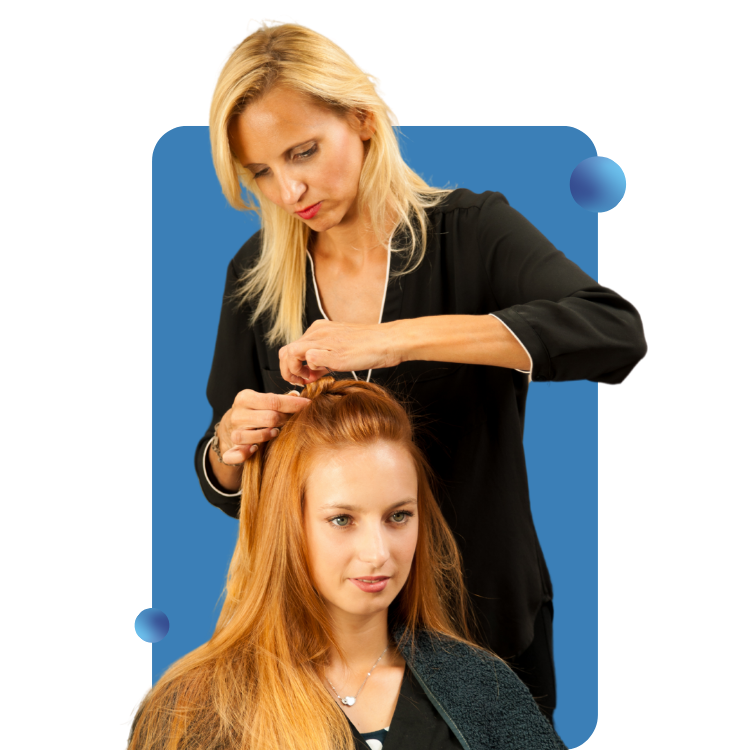 A female hairstylist is working on a woman's hair