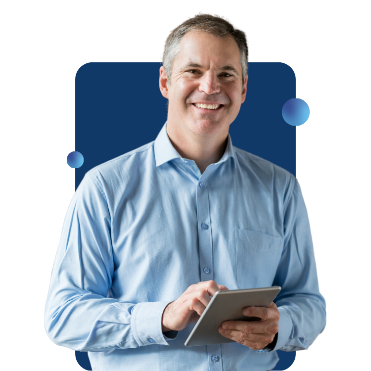 A smiling male business owner holds a tablet